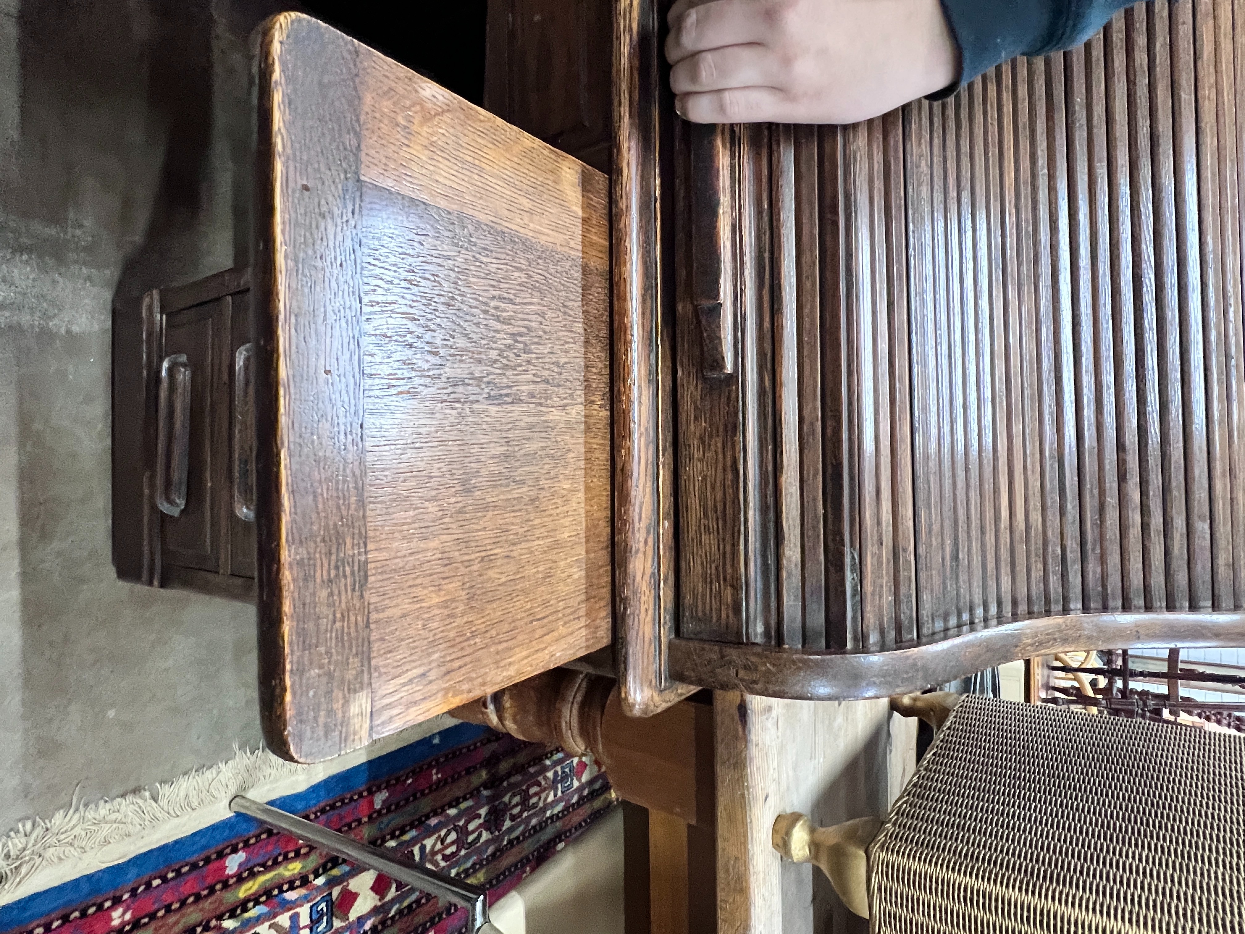 A 1920's oak roll top oak desk with S shaped tambour, width 121cm, depth 65cm, height 114cm